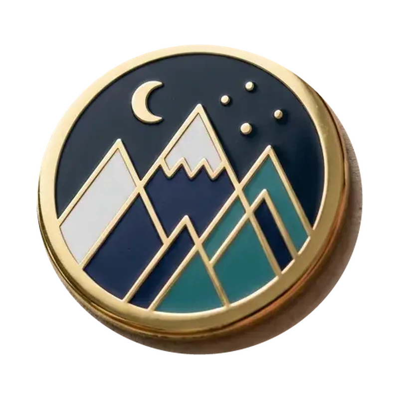 Mountain-themed hard enamel pin design shown on a backing card